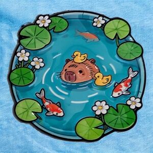 Capybara Hanging With Ducks And Koi Fish In A Pond Enamel Pin